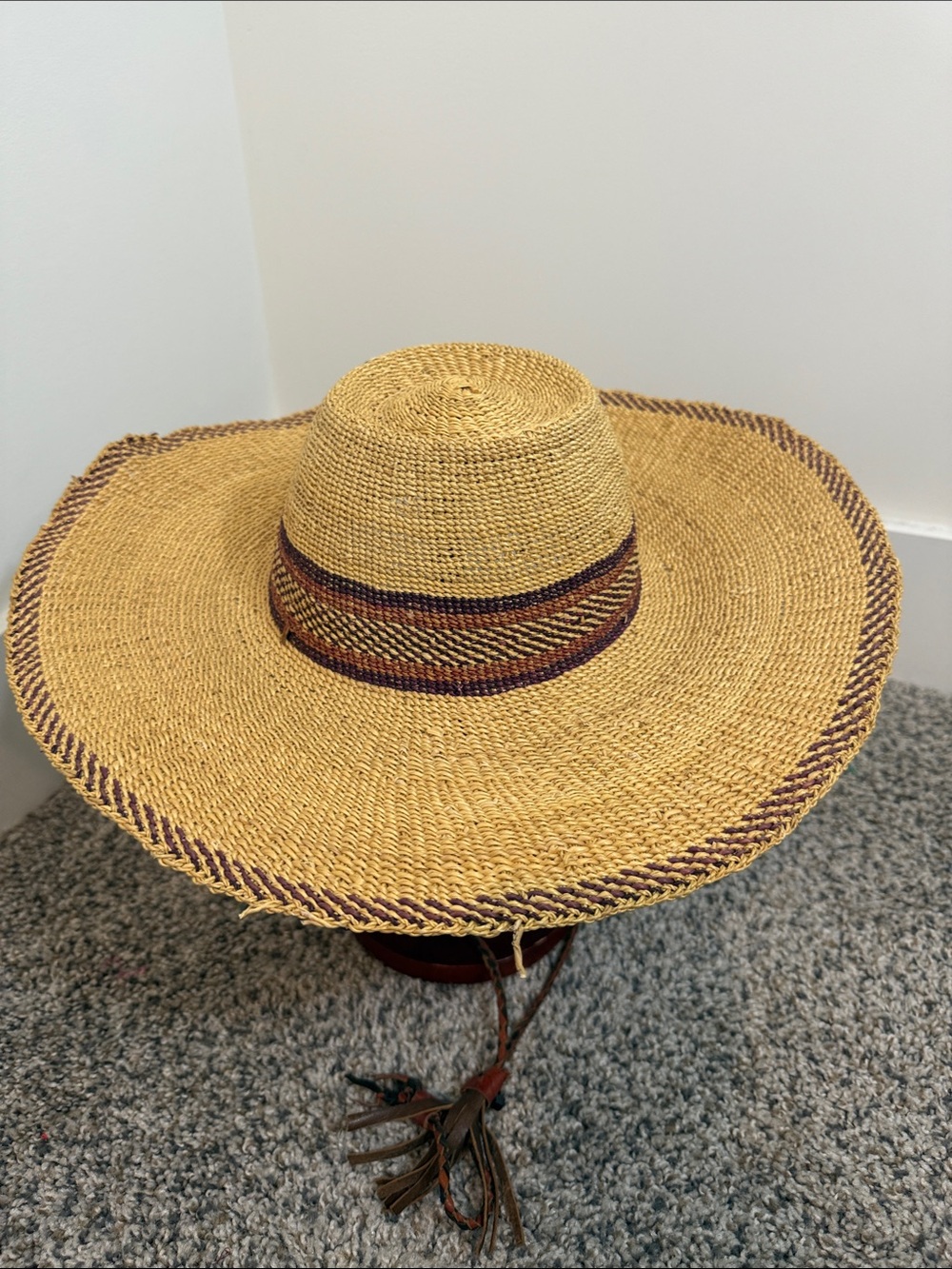 handwoven Ghanaian Bolga straw sun hat featuring a wide brim